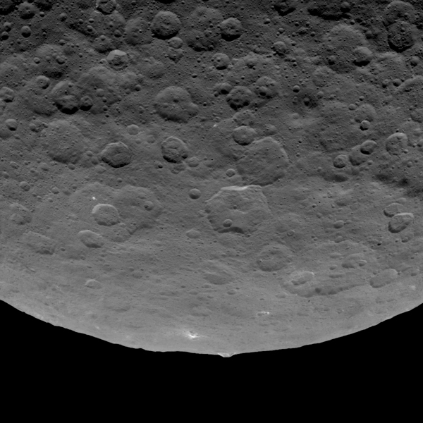This image, taken by NASA's Dawn spacecraft, shows an intriguing mountain on dwarf planet Ceres protruding from a relatively smooth area. Scientists estimate that this structure rises about 3 miles (5 kilometers) above the surface. Dawn captured this image from an altitude of 2,700 miles (4,400 kilometers). The image, with a resolution of 1,400 feet (410 meters) per pixel, was taken on June 14, 2015.